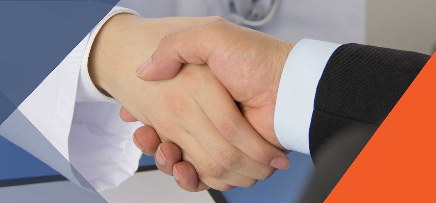 Businessman shaking hands with Nurse Leader